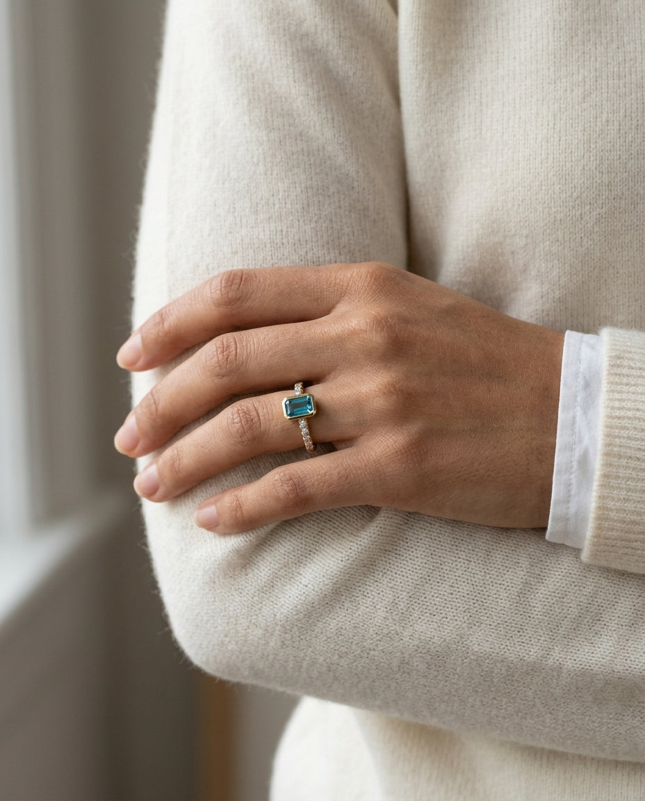 Swiss Blue Topaz Emerald Cut And Diamond Ring In 14k Yellow Gold — editorial close-up