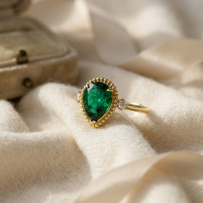 Created Emerald & Diamond 1/16ctw Ring Set in 14k Yellow Gold — textile flat lay