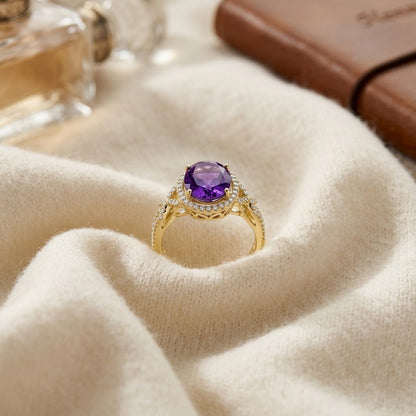 Amethyst and Diamond Oval Halo Ring in 14k Yellow Gold 1/4ctw — textile flat lay