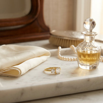 14k Yellow Gold Round and Emerald Cut Diamond Ring — marble silk