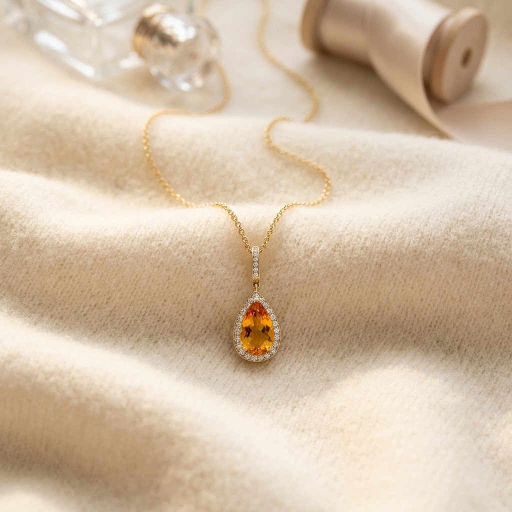 Citrine Pear And Diamond Halo Pendant In 14k Yellow Gold (1/2 Ct. Tw.) — textile flat lay