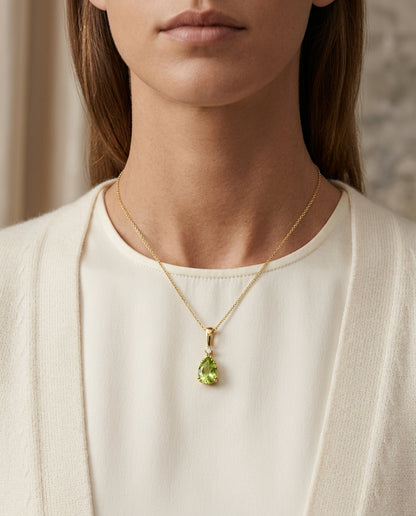 Peridot And Diamond Pendant In 14k Yellow Gold (9x6mm) — editorial close-up