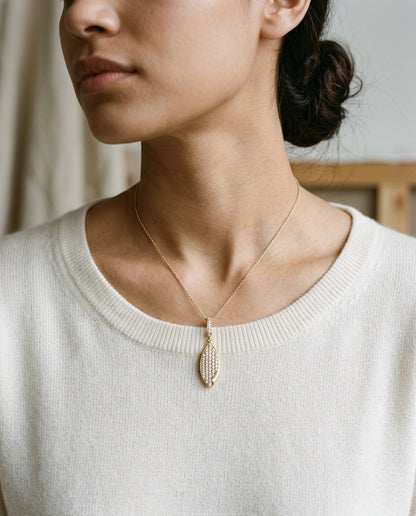 Diamond Pave Folded Corner Pointed Oval Pendant In 14k Yellow Gold — editorial close-up