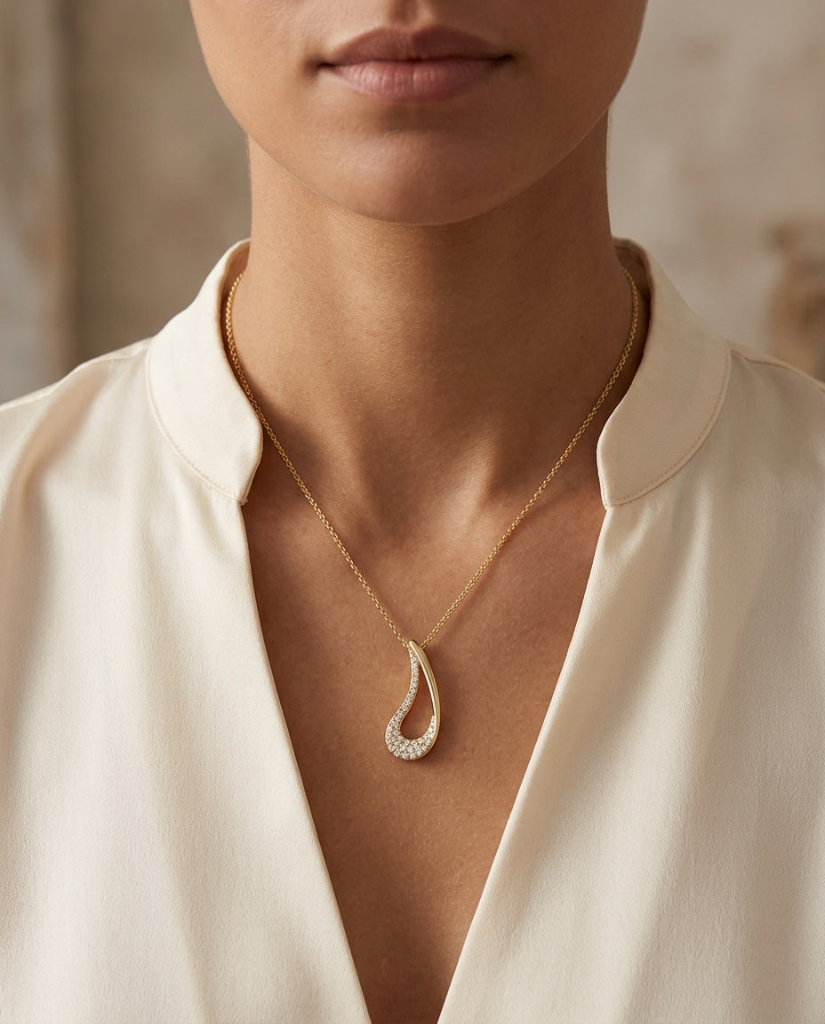 Diamond Curved Tear Drop Pendant In 14k Yellow Gold — editorial close-up
