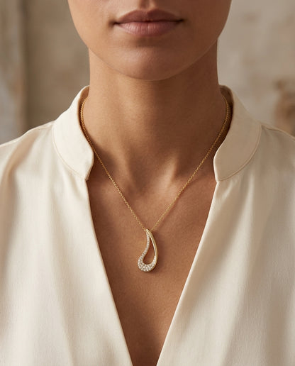 Diamond Curved Tear Drop Pendant In 14k Yellow Gold — editorial close-up