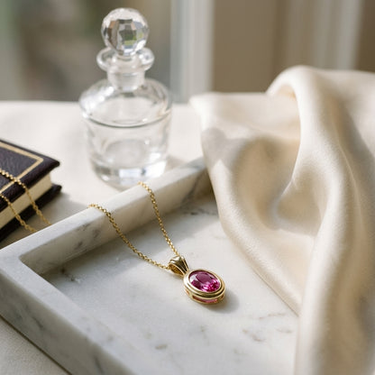Pink Saphire Oval Bezel Solitaire Pendant In 14k Yellow Gold (18 Inch Rolo Chain) — atelier still life