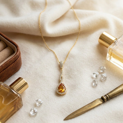 Citrine And Diamond Pendant In 14k Yellow Gold (1/4 Ct.tw.) — textile flat lay