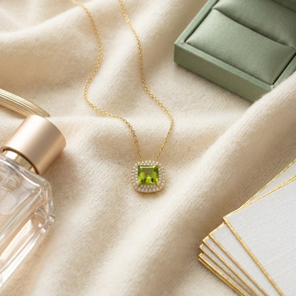 Peridot Cushion and Diamond Double Halo Pendant in 14k Yellow Gold (7mm) — textile flat lay