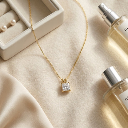 Princess Diamond Solitaire Pendant in a 14k Yellow Gold 4-Prong Basket Setting, 1ct. T.w. (I, Vs2 Igi) — textile flat lay