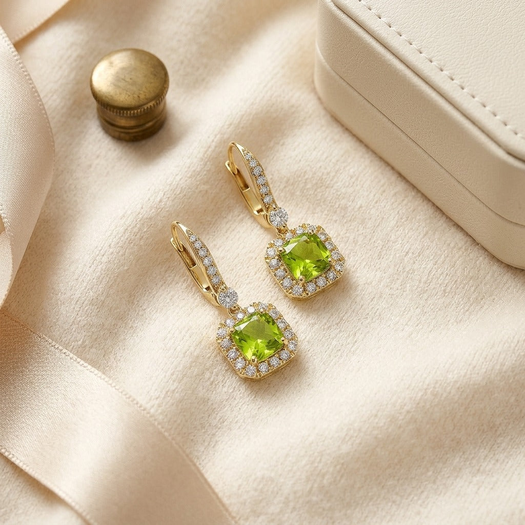 Peridot and Diamond Cushion Dangle Earrings with Pave Tops in 14k Yellow Gold (6mm) — textile flat lay