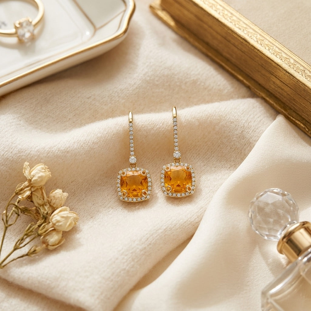 Citrine And Diamond Halo Cushion Dangle Earrings In 14k Yellow Gold 1/4ctw — textile flat lay