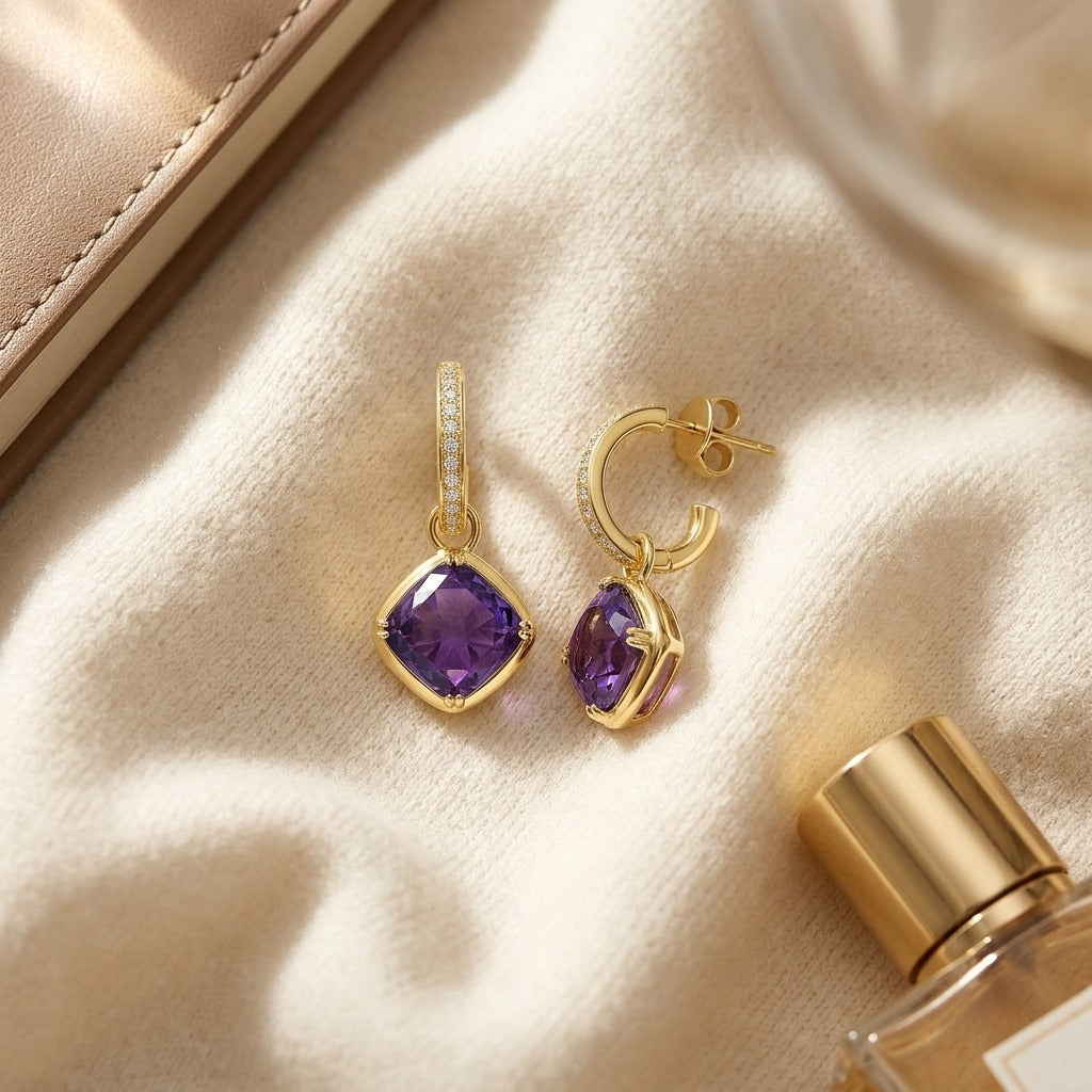 Amethyst Cushion Bezel Dangle Earrings with Pave Diamond Tops in 14k Yellow Gold — textile flat lay