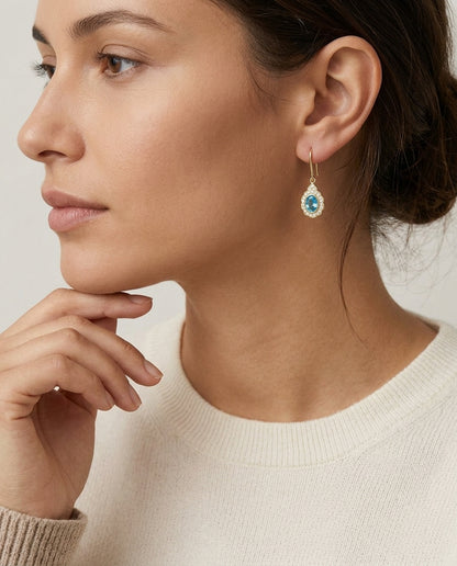 Blue Topaz And Diamond Oval Bezel Leverback Earrings With Teardrop Scallop Frame In 14k Yellow Gold 1/2ctw — editorial close-up