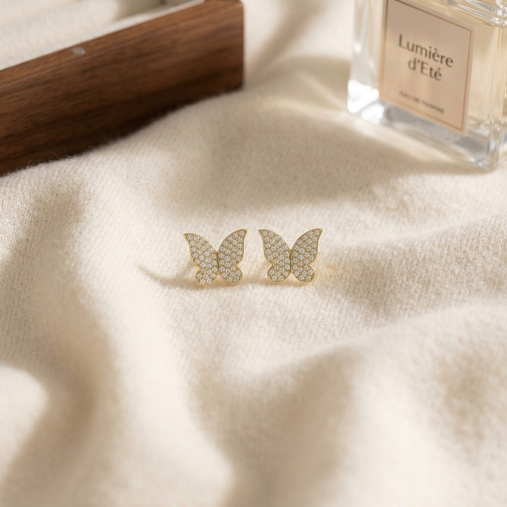 Diamond Butterfly Earrings in 14k Yellow Gold 1/3ctw — textile flat lay