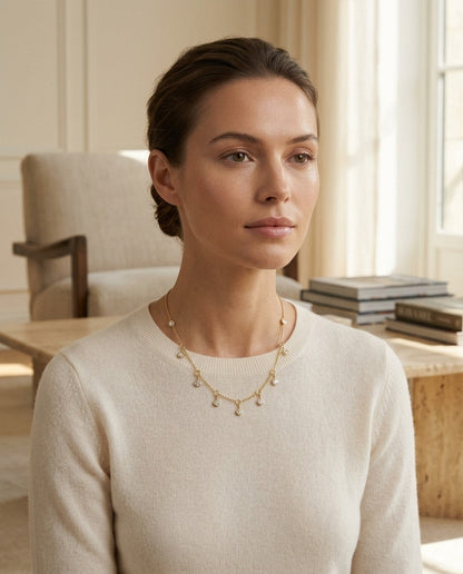 Diamond Station Necklace with Fixed and Dangling Bezels in 14k Yellow Gold — portrait close