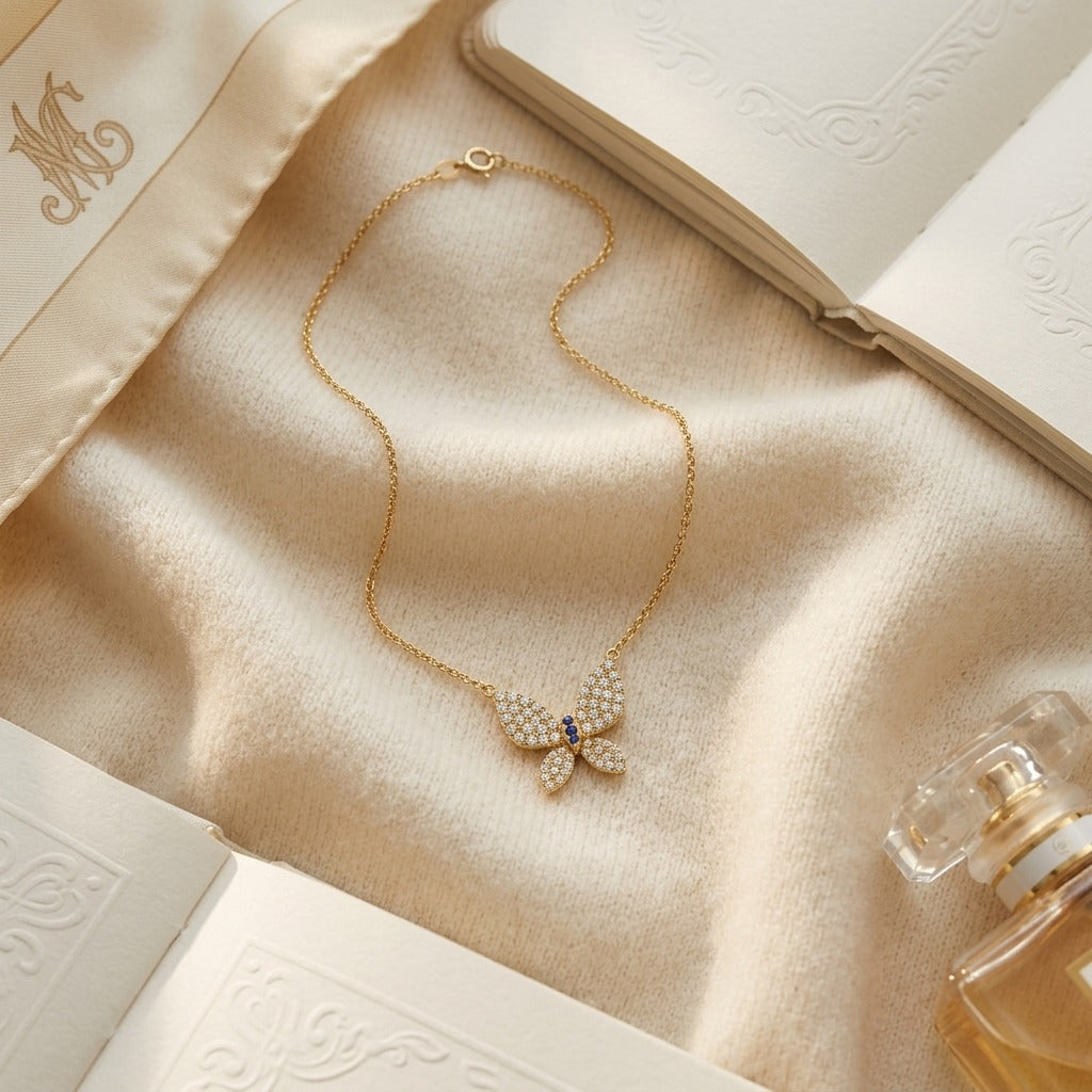 Diamond 1/2ctw & Blue Sapphire Necklace 16-18 Adj Chain Set in 14k Yellow Gold — textile flat lay