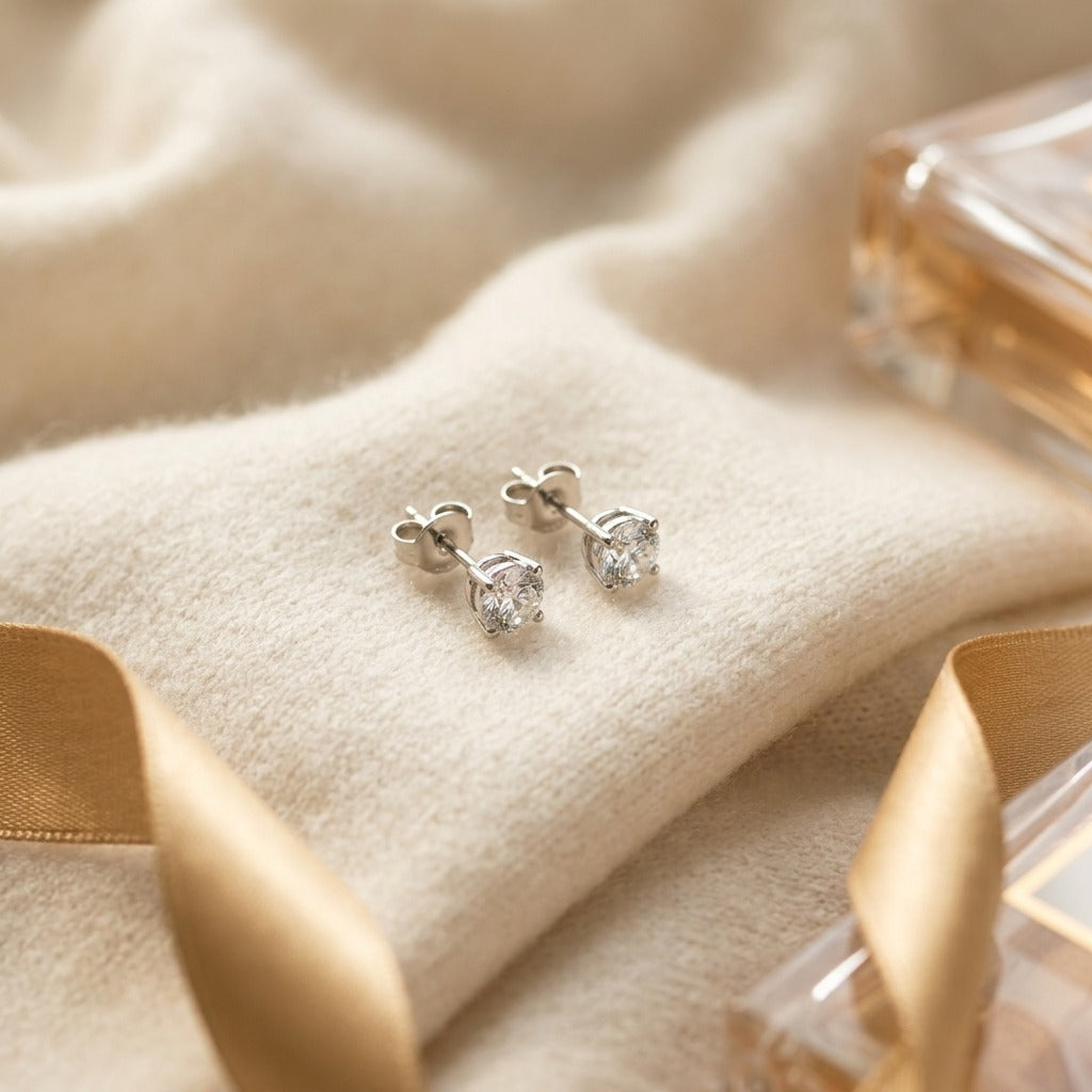 14k Yellow Gold 4-Prong Round Brilliant Diamond Stud Earrings (1.06 Ct. T.w., Vs1-Vs2 Clarity, H-I Color) — textile flat lay