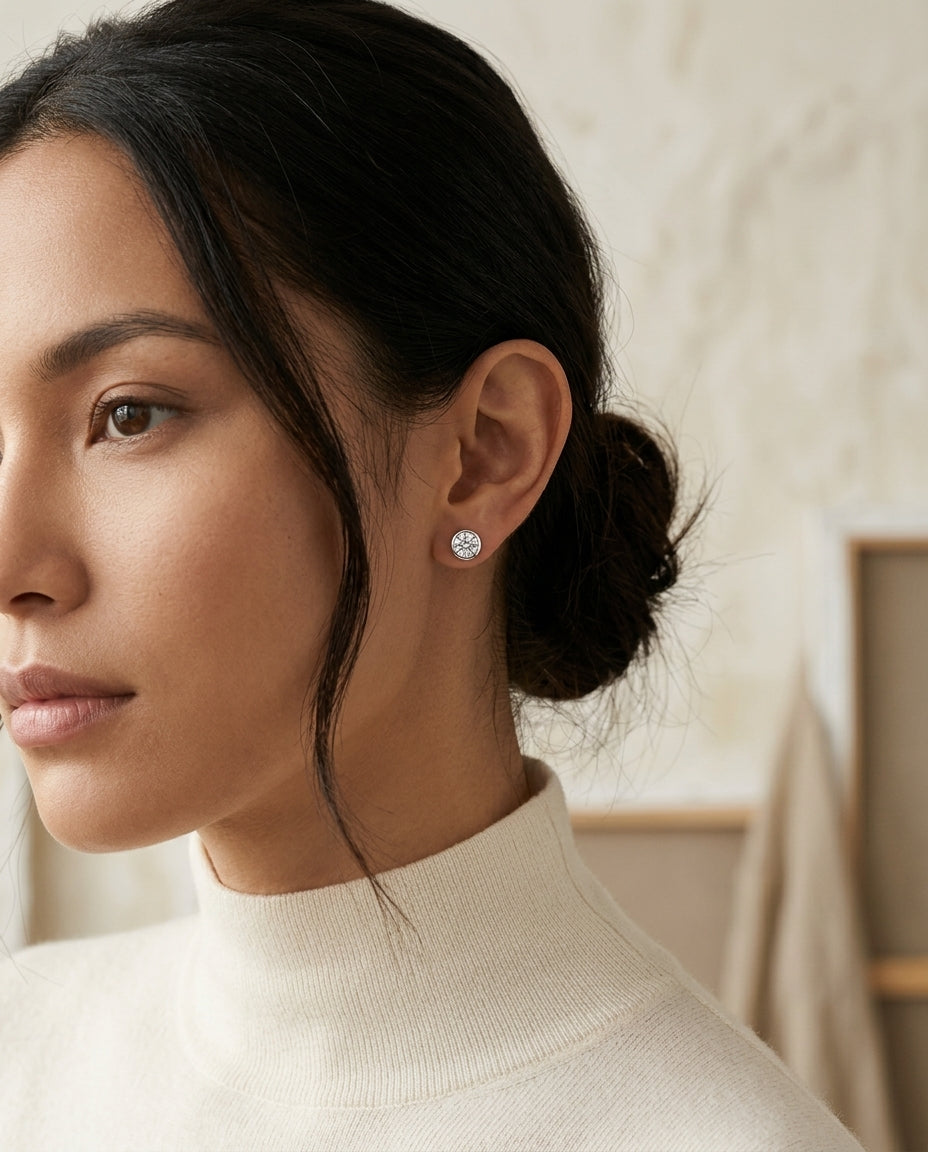 Diamond Round Bezel Studs In Platinum — editorial close-up