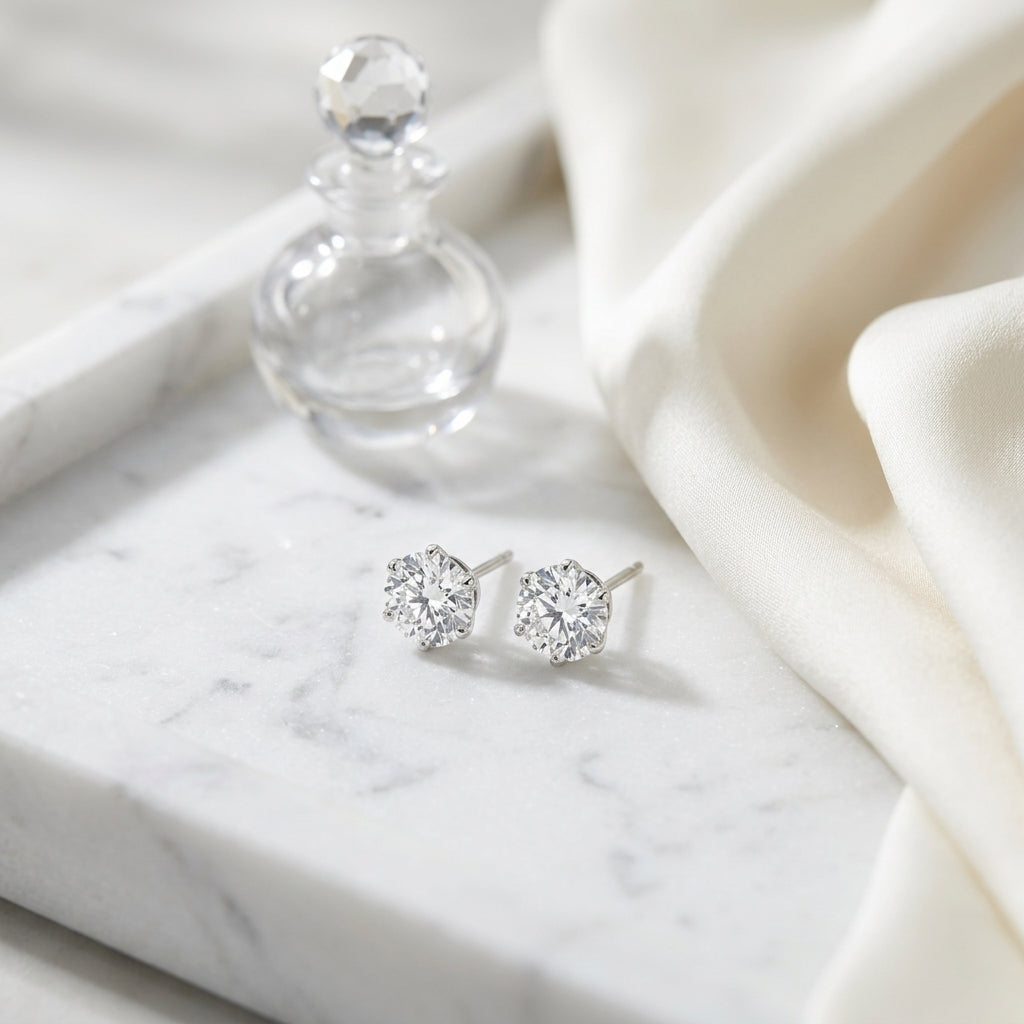 Platinum 3-prong Round Brilliant Diamond Stud Earrings (0.75 Ct. T.w., Vs1-vs2 Clarity, F-g Color) — atelier still life
