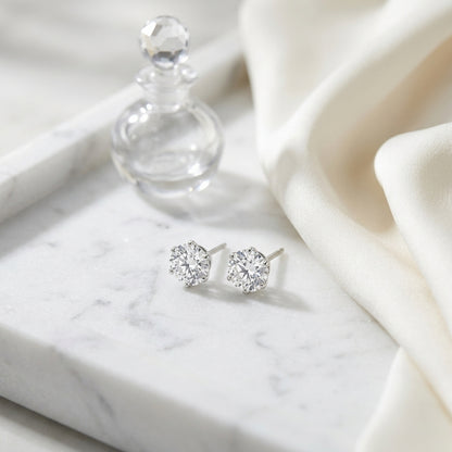 Platinum 3-prong Round Brilliant Diamond Stud Earrings (0.75 Ct. T.w., Vs1-vs2 Clarity, F-g Color) — atelier still life