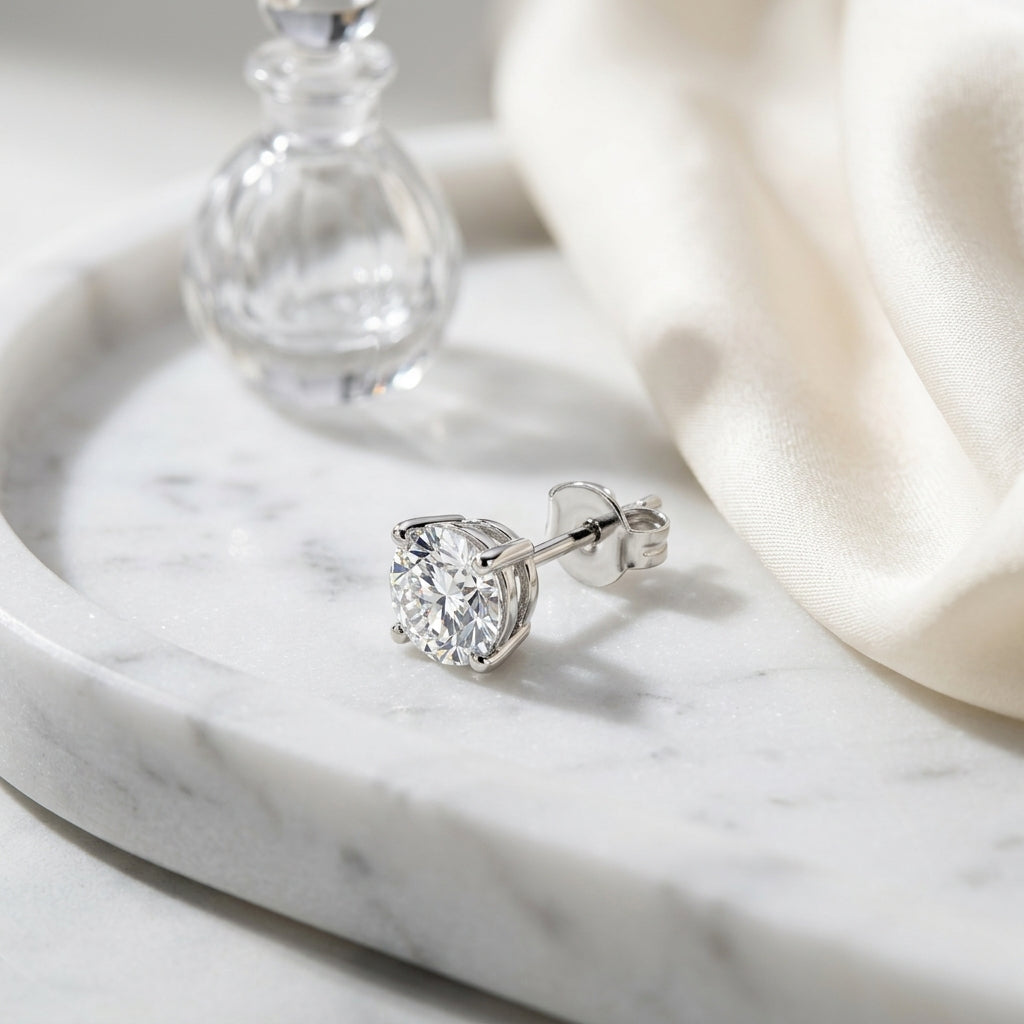 Platinum 4-prong Round Brilliant Diamond Stud Earrings (0.75 Ct. T.w., Vs1-vs2 Clarity, F-g Color) — atelier still life