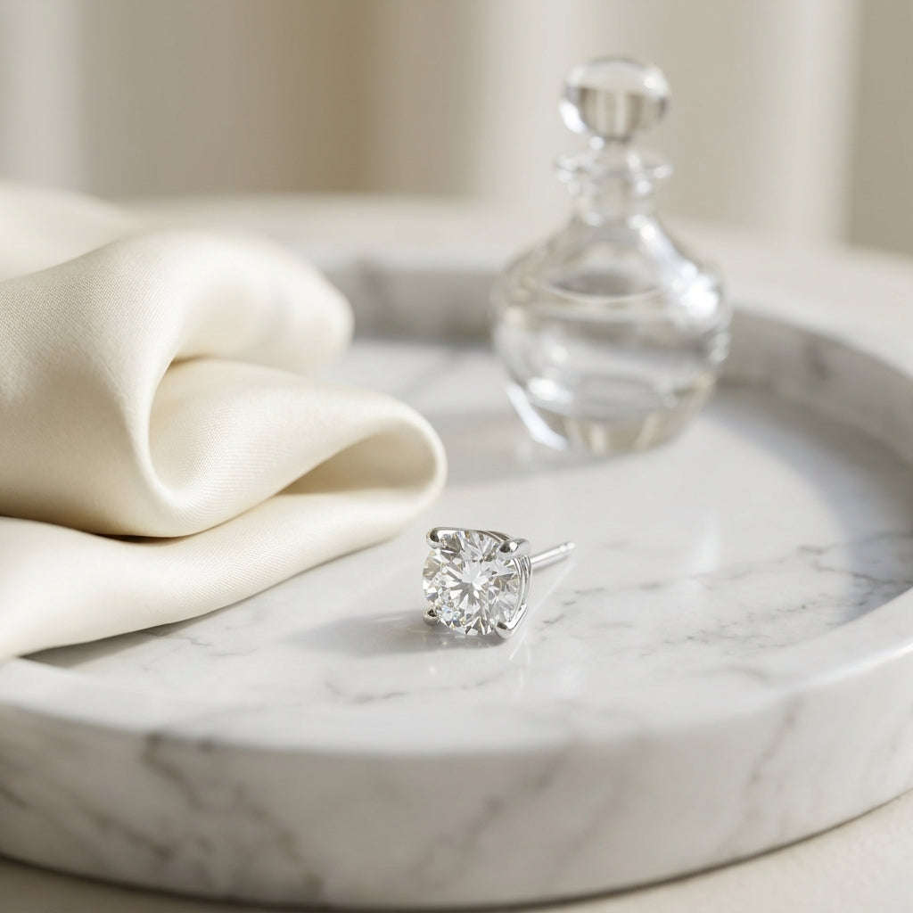 Platinum 4-prong Round Brilliant Diamond Stud Earrings (1.06 Ct. T.w., Vs1-vs2 Clarity, F-g Color) — atelier still life